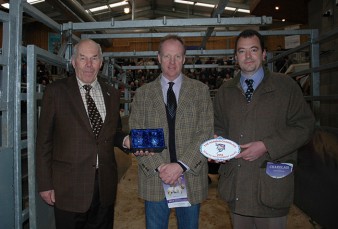 Alasdair Houston being awarded the prize by Society President Ralph Needham and Ben Harman
